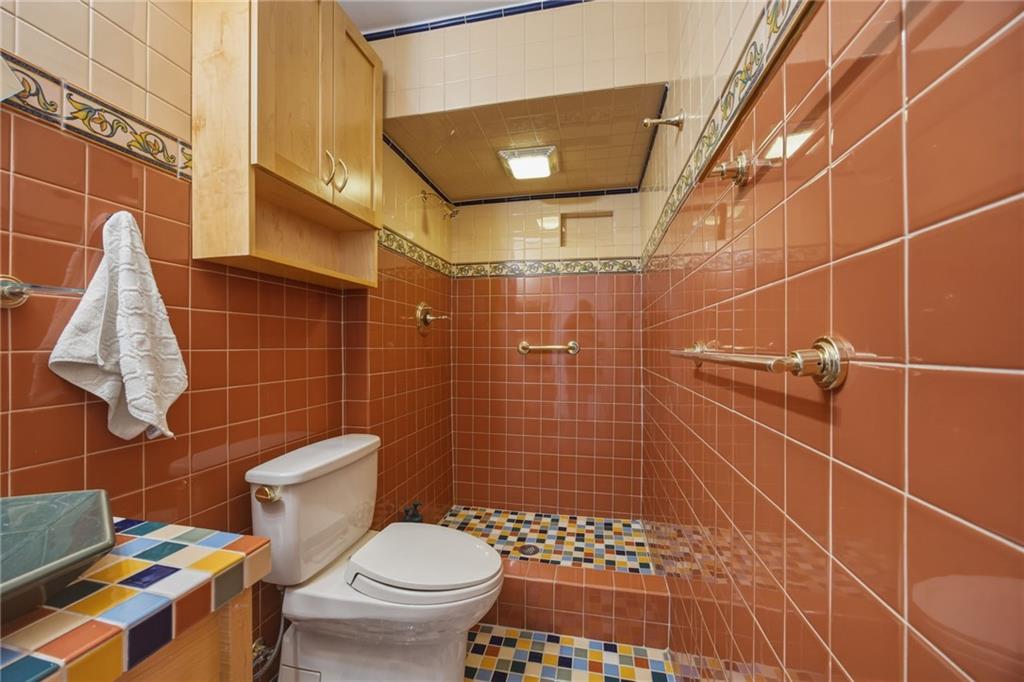 5535 Forbes Avenue, Unit E Pittsburgh, PA 15217 - Photo 23 of 50 a bathroom with a toilet and a shower