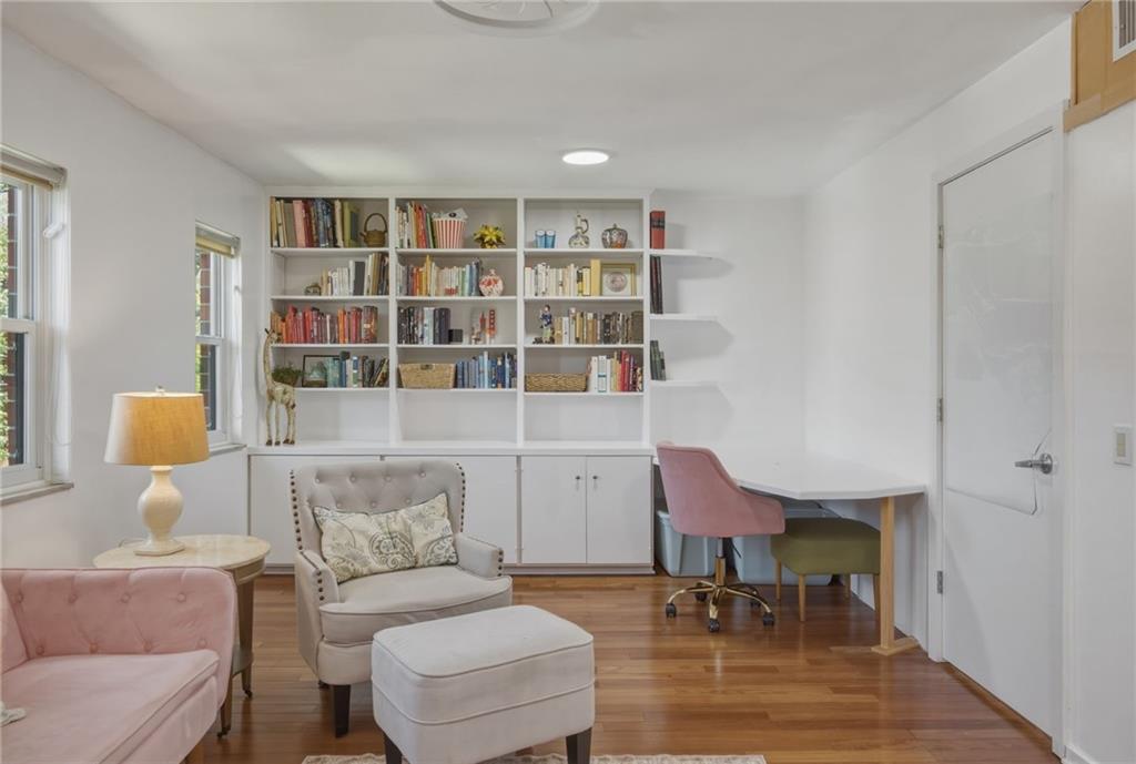 5535 Forbes Avenue, Unit E Pittsburgh, PA 15217 - Photo 27 of 50 a living room with furniture and a chair with potted plant on the table
