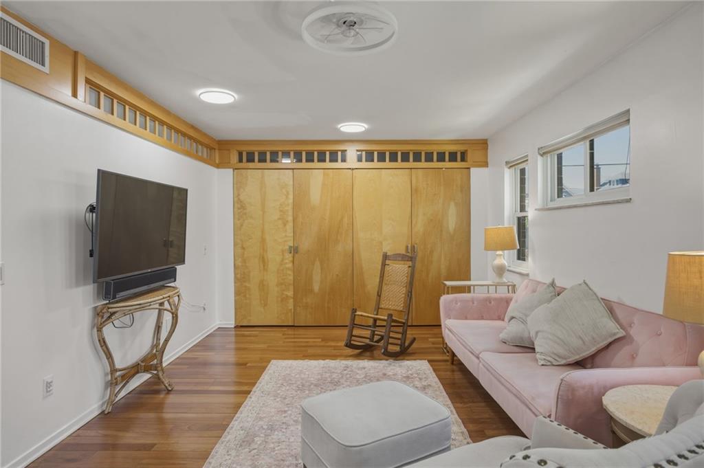 5535 Forbes Avenue, Unit E Pittsburgh, PA 15217 - Photo 28 of 50 a living room with furniture and a flat screen tv