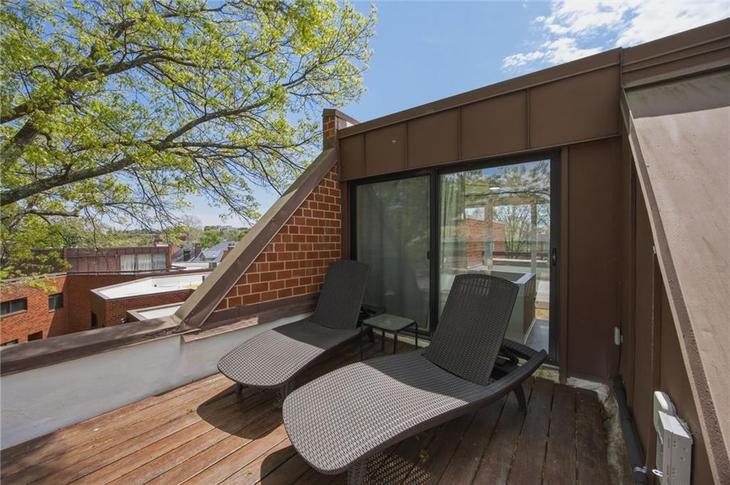 5535 Forbes Avenue, Unit E Pittsburgh, PA 15217 - Photo 38 of 50 a balcony with wooden floor table and chairs