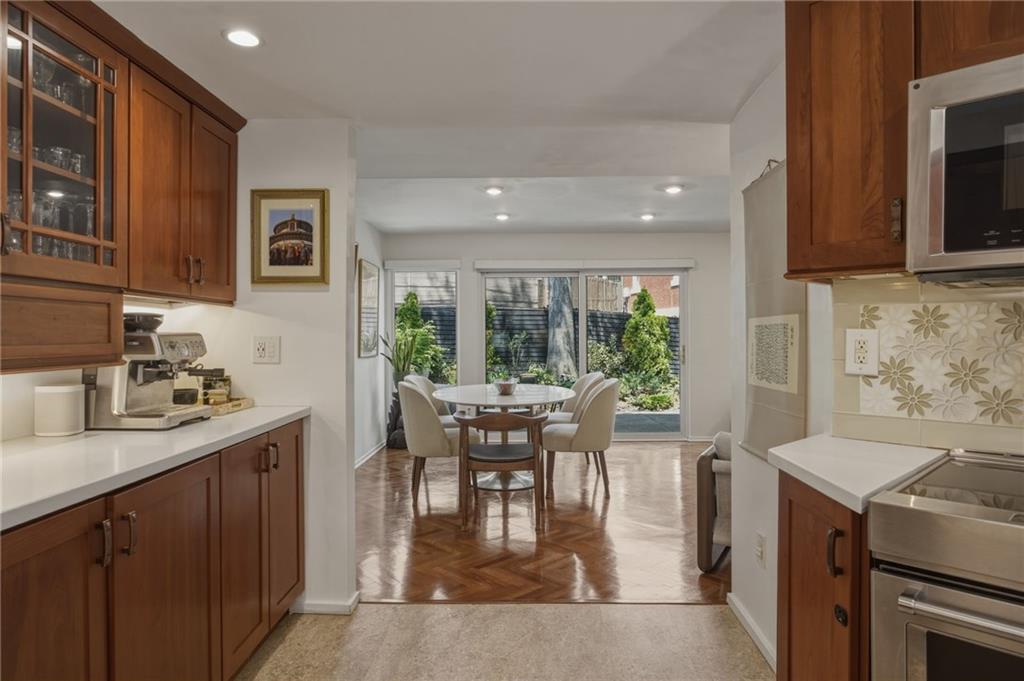 5535 Forbes Avenue, Unit E Pittsburgh, PA 15217 - Photo 9 of 50 a kitchen with a stove a sink and a refrigerator