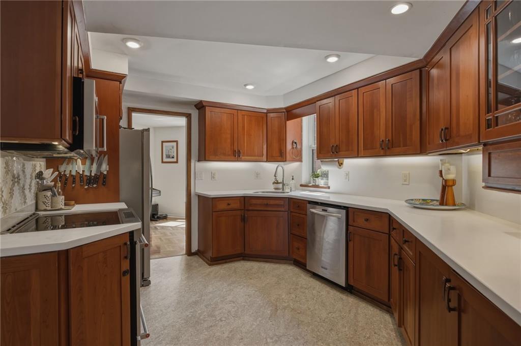 5535 Forbes Avenue, Unit E Pittsburgh, PA 15217 - Photo 10 of 50 a kitchen with stainless steel appliances granite countertop a sink stove and refrigerator