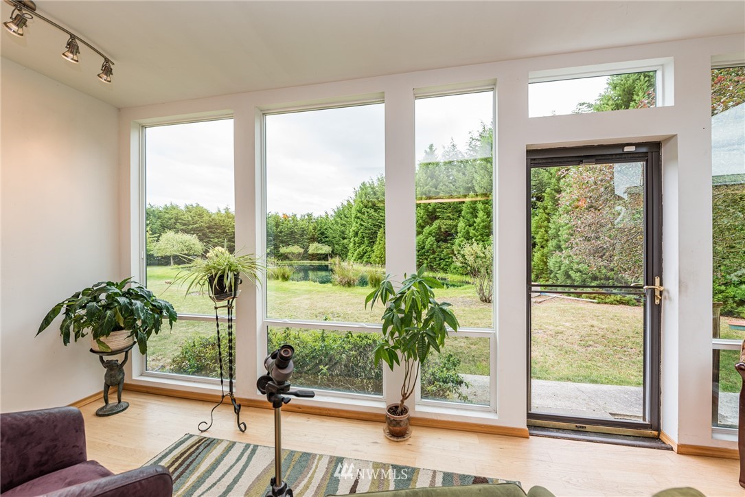 139 Buckhorn Road Sequim, WA 98382 - Photo 12 of 29 a view of a room with wooden floor and a potted plant