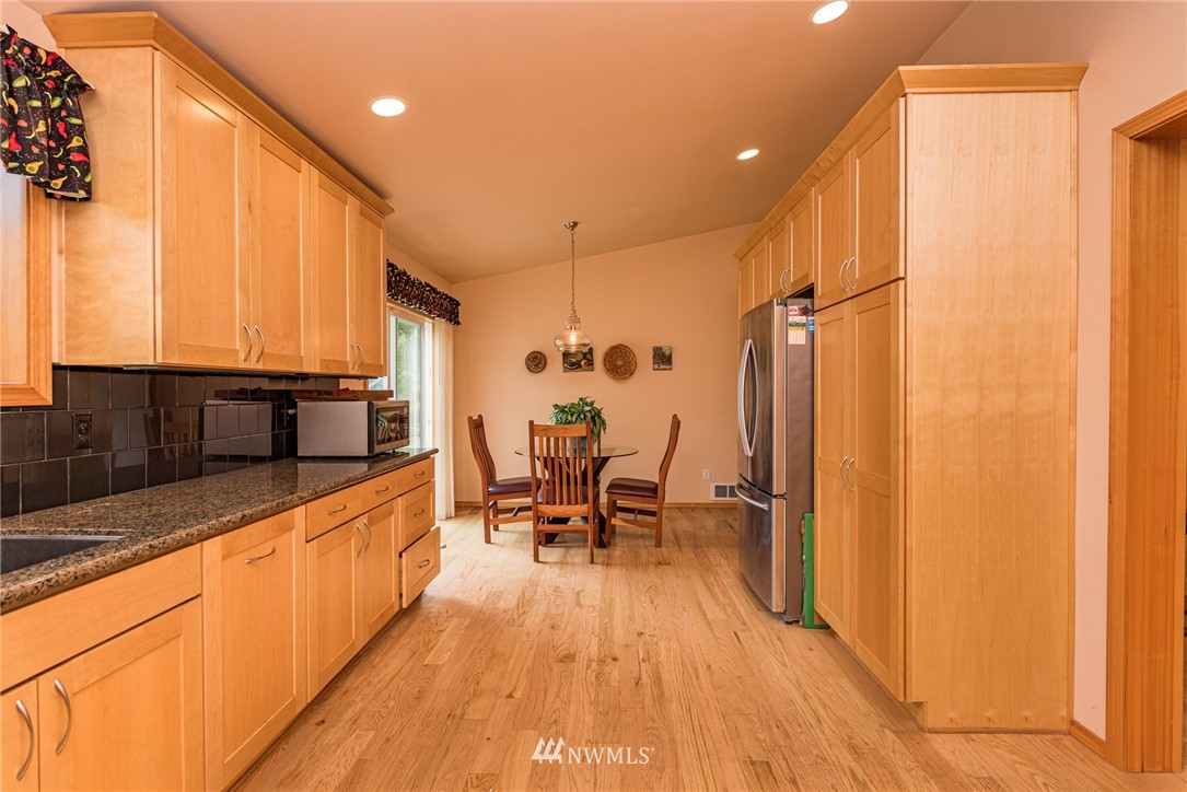 139 Buckhorn Road Sequim, WA 98382 - Photo 14 of 29 a large white kitchen with a large window