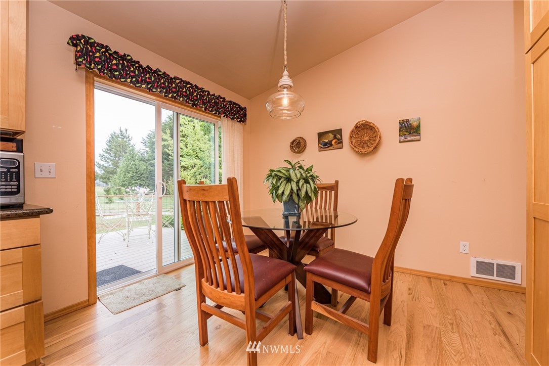 139 Buckhorn Road Sequim, WA 98382 - Photo 15 of 29 a view of a dining room with furniture and wooden floor