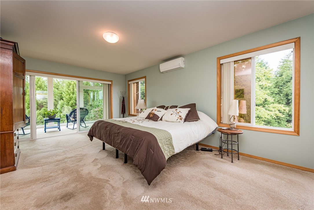 139 Buckhorn Road Sequim, WA 98382 - Photo 16 of 29 a bedroom with a bed and a large window