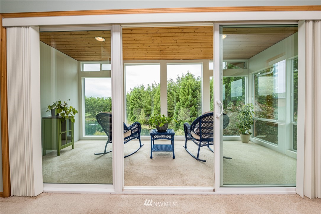 139 Buckhorn Road Sequim, WA 98382 - Photo 17 of 29 a view of a house with a porch and furniture