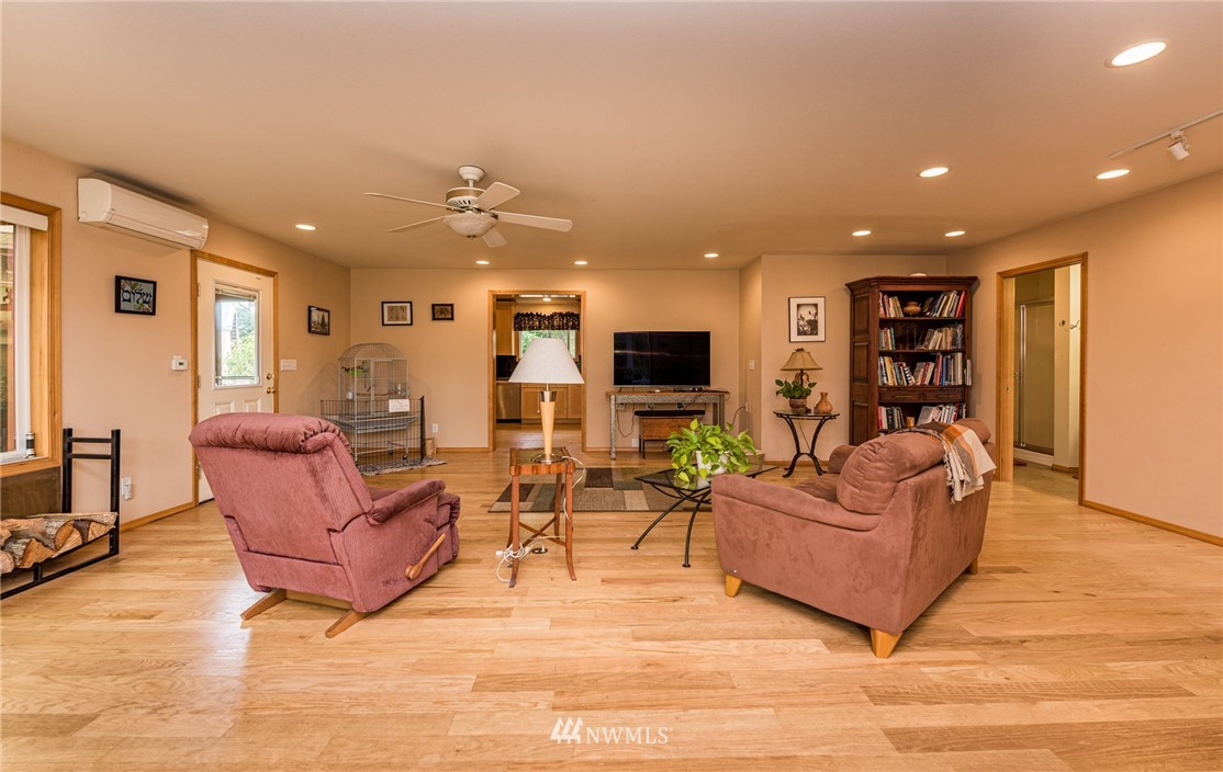 139 Buckhorn Road Sequim, WA 98382 - Photo 10 of 29 a living room with furniture kitchen and a table