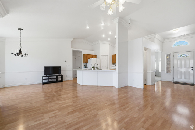 805 South River Road, Unit 70 St. George, UT 84790 - Photo 11 of 38 Bright living area featuring wood-finish flooring and crown molding