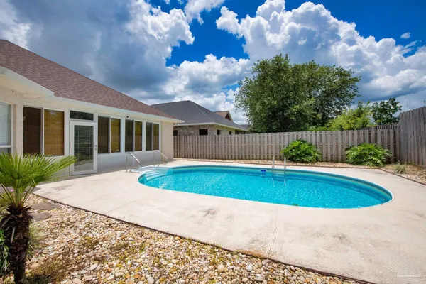 a view of pool with outdoor seating