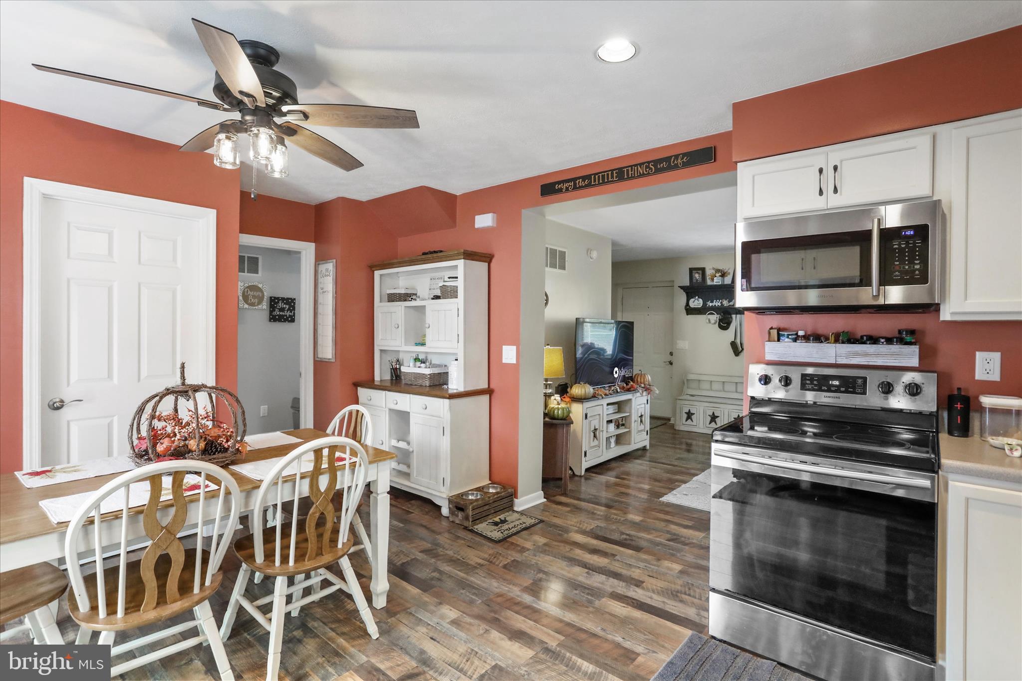 13719 Brant Road Southwest Cresaptown, MD 21502 - Photo 13 of 33 a kitchen with stainless steel appliances a table chairs and a refrigerator