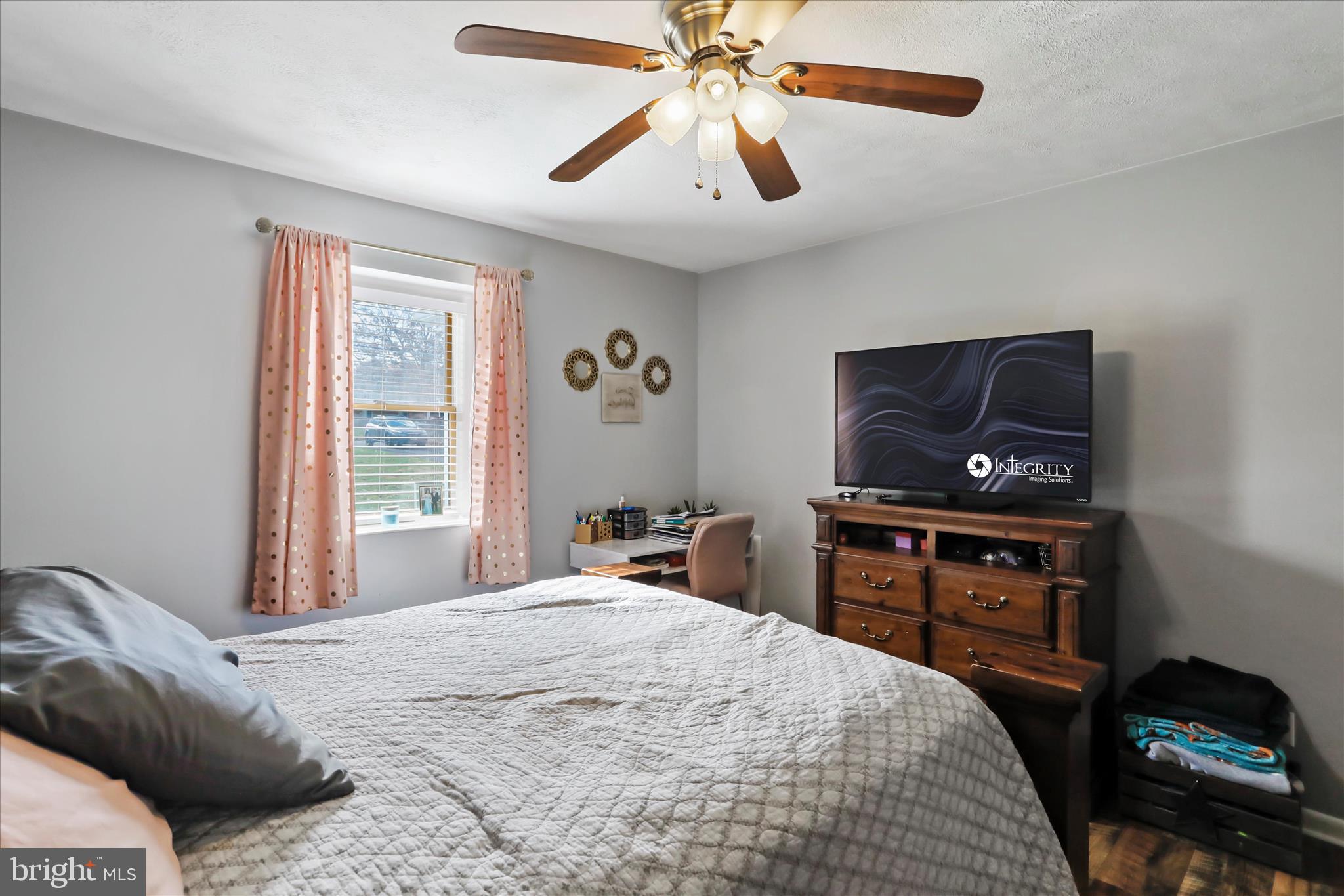 13719 Brant Road Southwest Cresaptown, MD 21502 - Photo 18 of 33 a bedroom with a bed and a chandelier