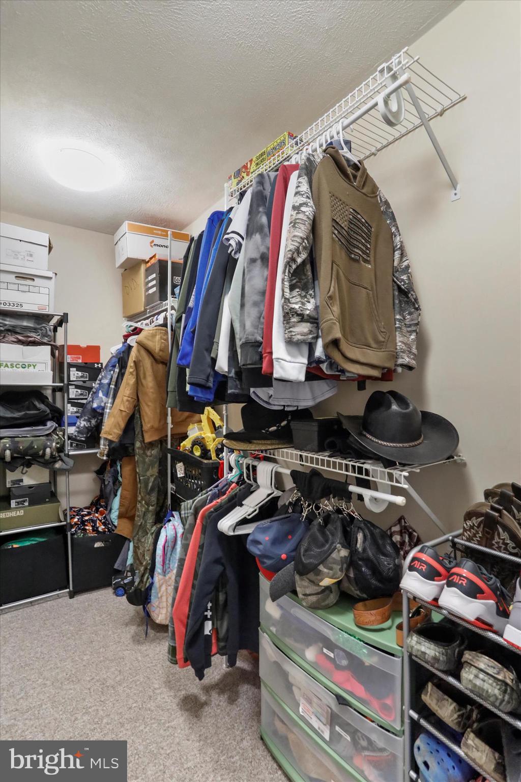 13719 Brant Road Southwest Cresaptown, MD 21502 - Photo 22 of 33 a view of walk in closet with clothes and shoes