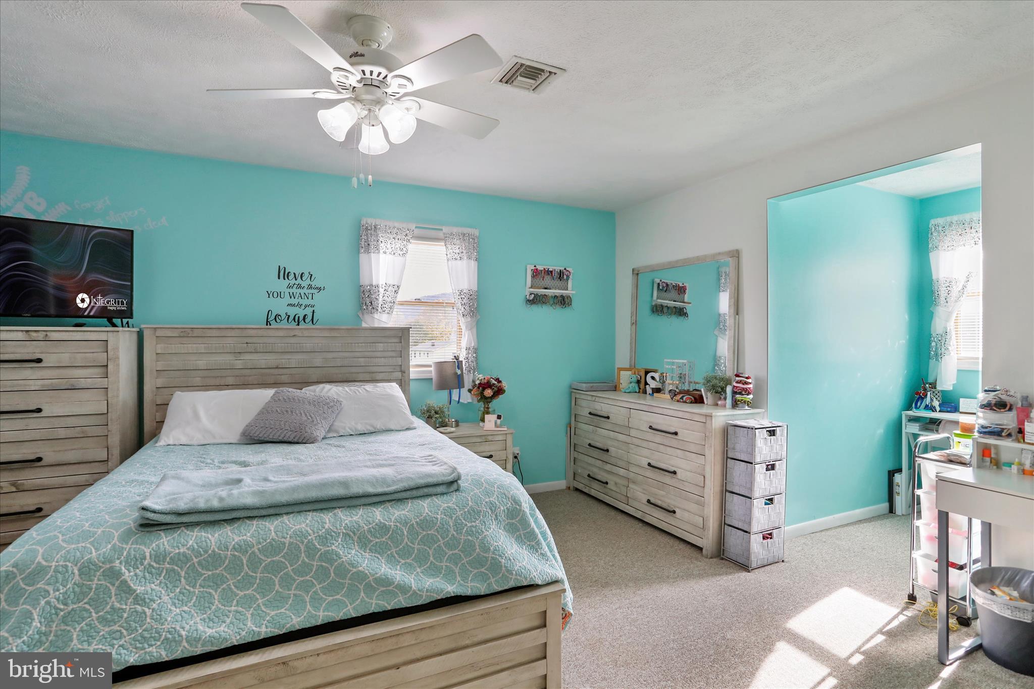13719 Brant Road Southwest Cresaptown, MD 21502 - Photo 27 of 33 a bedroom with a bed and a chandelier
