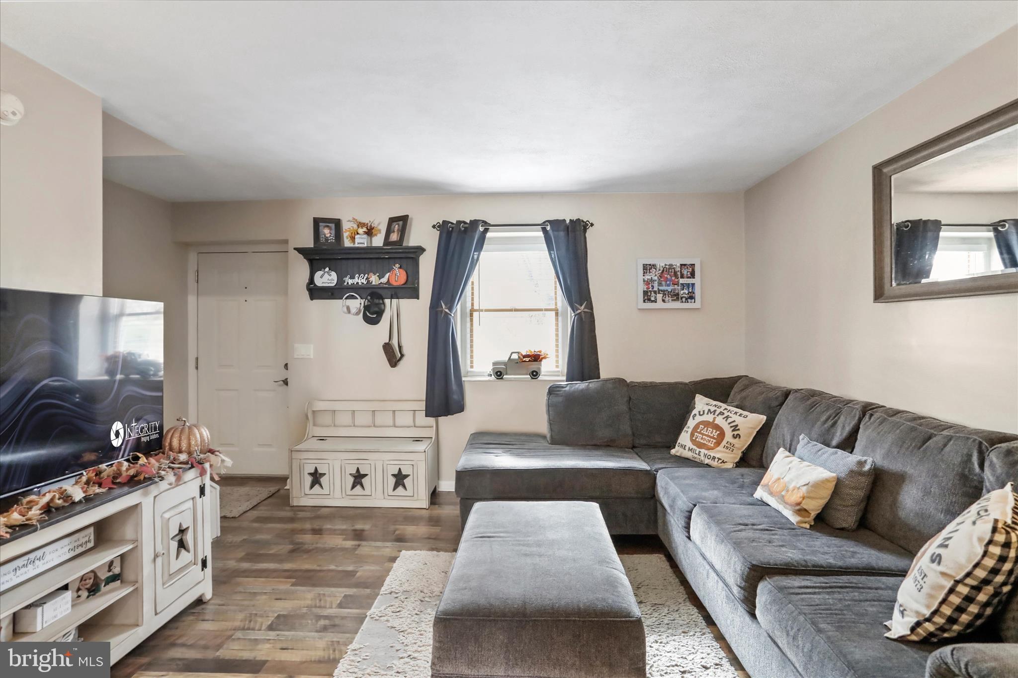 13719 Brant Road Southwest Cresaptown, MD 21502 - Photo 7 of 33 a living room with furniture and a flat screen tv