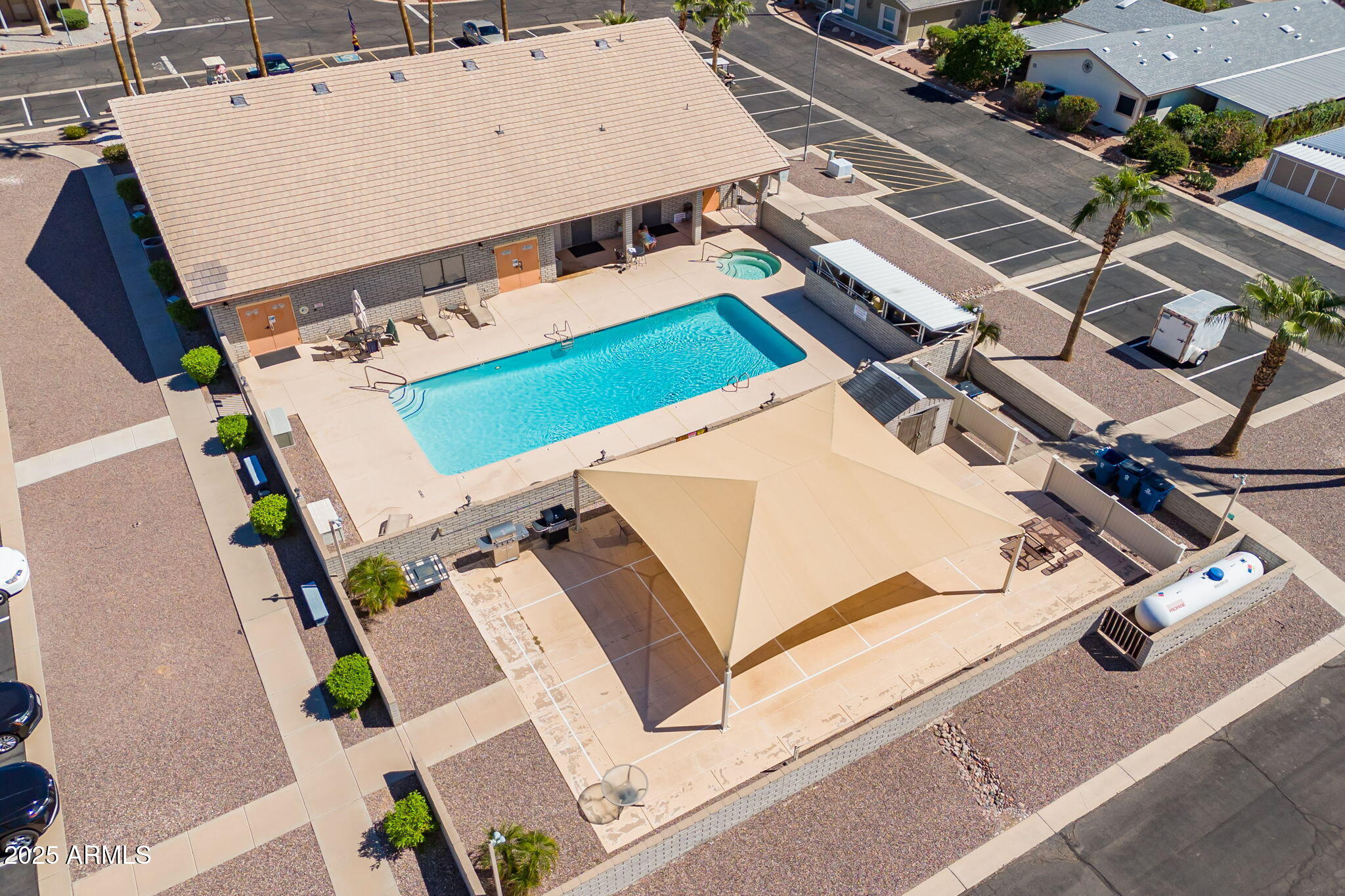 3700 South Tomahawk Road, Unit 39 Apache Junction, AZ 85119 - Photo 51 of 53 an aerial view of a house with a big yard and large tree