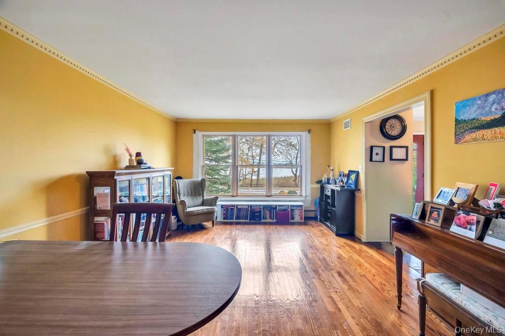 39 Bevin Road Northport, NY 11768 - Photo 22 of 44 Sitting room with ornamental molding and wood finished floors