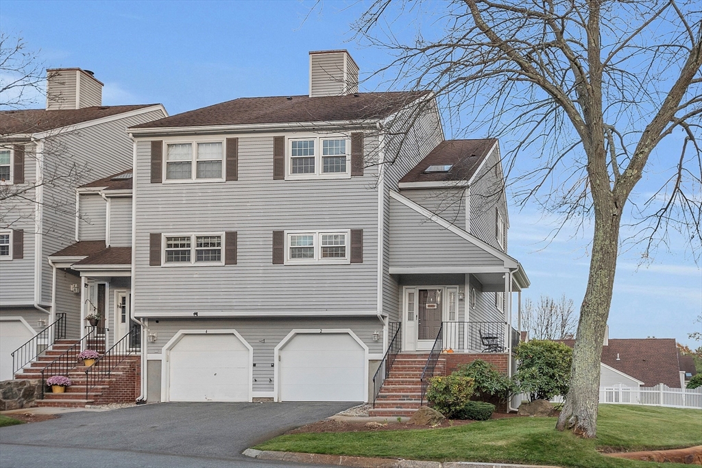 2 Countryside Lane, Unit 1301 Salem, MA 01970 - Photo 1 of 37 a front view of a house with garden