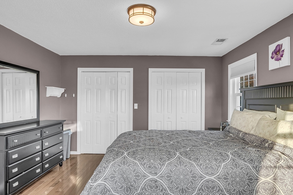 2 Countryside Lane, Unit 1301 Salem, MA 01970 - Photo 11 of 37 a bedroom with a bed and a dresser