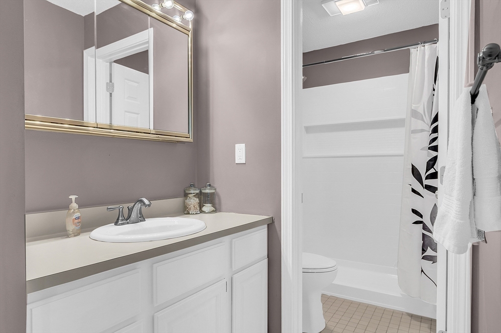2 Countryside Lane, Unit 1301 Salem, MA 01970 - Photo 13 of 37 a bathroom with a sink toilet and shower