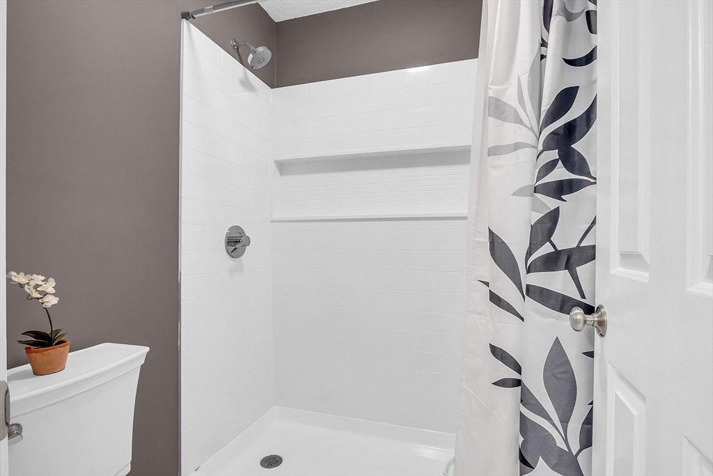 2 Countryside Lane, Unit 1301 Salem, MA 01970 - Photo 14 of 37 a bathroom with a shower and a sink