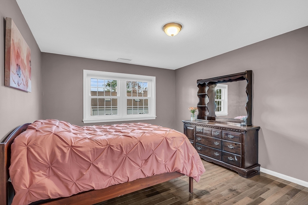 2 Countryside Lane, Unit 1301 Salem, MA 01970 - Photo 15 of 37 a bedroom with a bed and a dresser