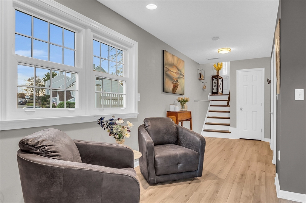 2 Countryside Lane, Unit 1301 Salem, MA 01970 - Photo 20 of 37 a living room with furniture and a large window