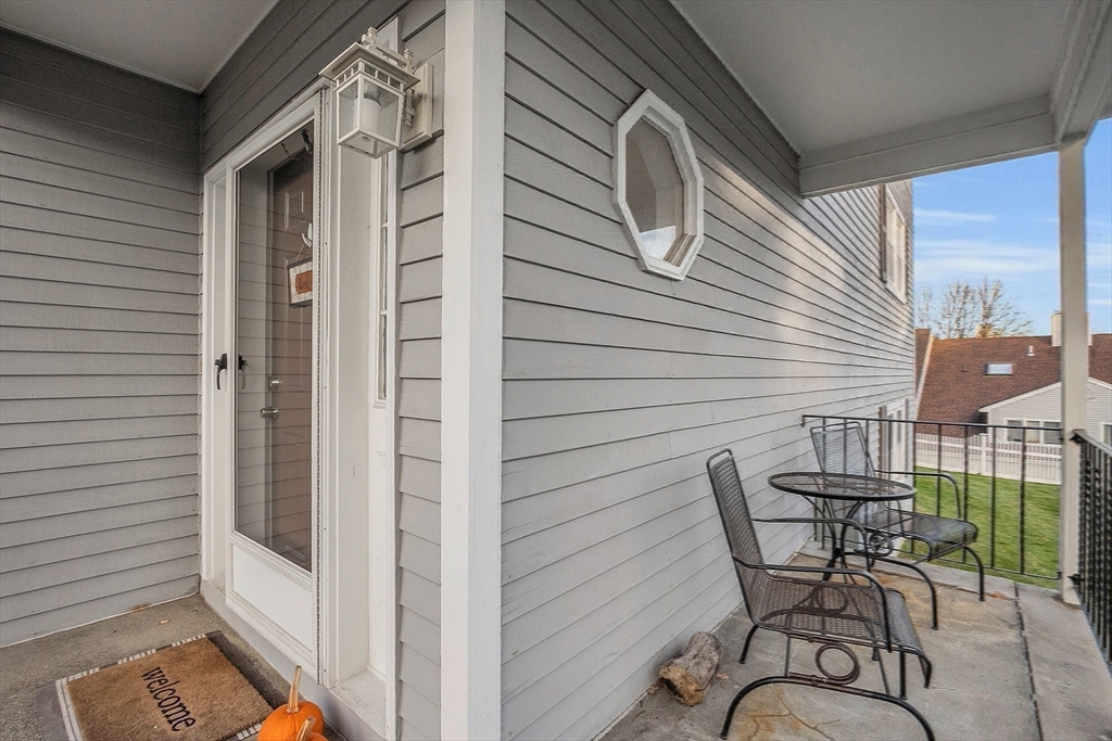 2 Countryside Lane, Unit 1301 Salem, MA 01970 - Photo 31 of 37 a view of a patio with a table and chairs