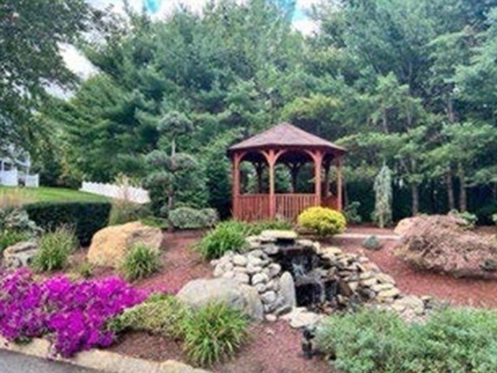 2 Countryside Lane, Unit 1301 Salem, MA 01970 - Photo 33 of 37 a view of a backyard with sitting area