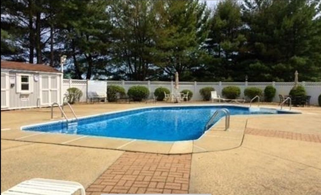 2 Countryside Lane, Unit 1301 Salem, MA 01970 - Photo 34 of 37 a view of a swimming pool with a patio