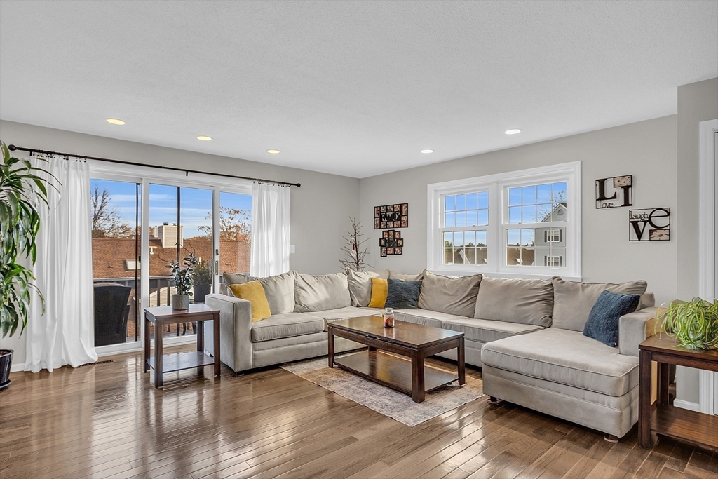 2 Countryside Lane, Unit 1301 Salem, MA 01970 - Photo 6 of 37 a living room with furniture and a large window