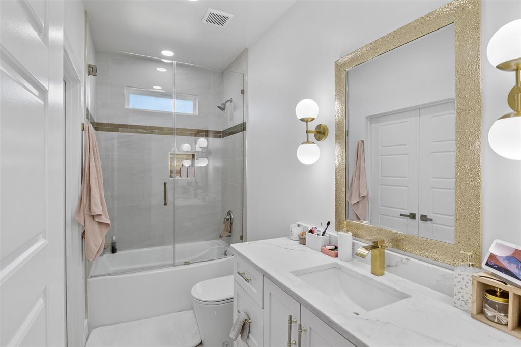 200 Corral Road Godley, TX 76044 - Photo 11 of 19 a bathroom with a sink a toilet and shower
