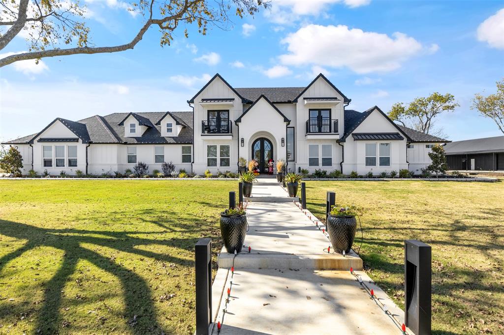 200 Corral Road Godley, TX 76044 - Photo 2 of 19 a view of a house with a big yard and large trees