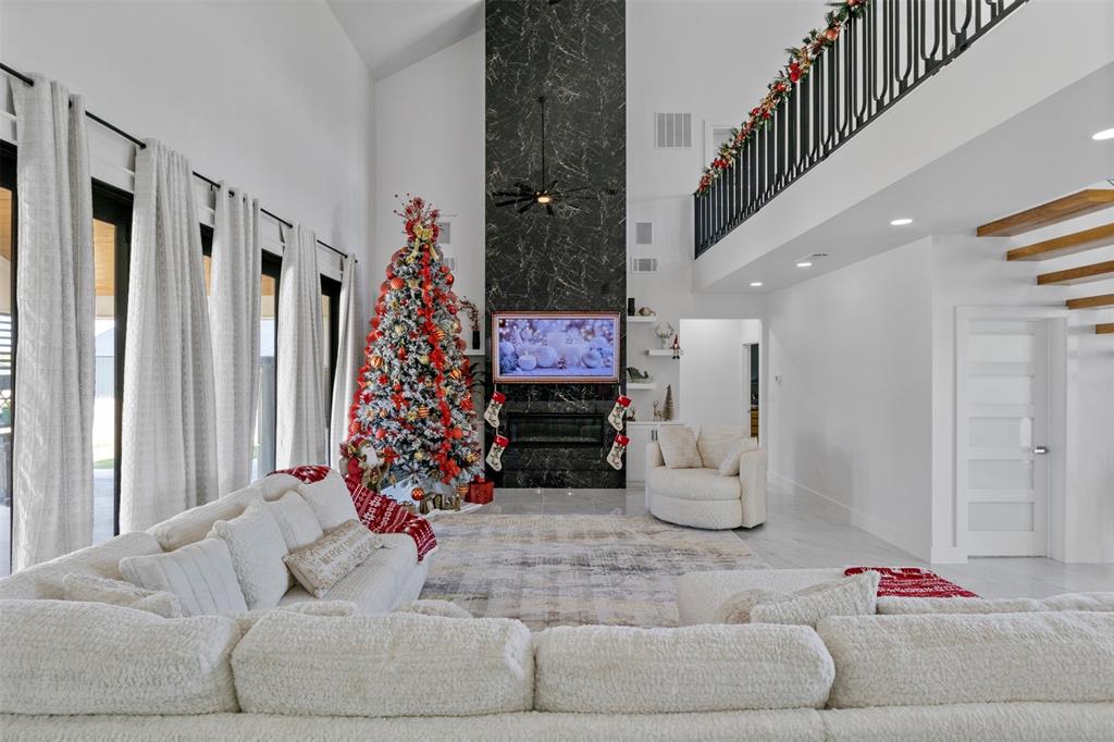 200 Corral Road Godley, TX 76044 - Photo 4 of 19 a living room with furniture and a chandelier