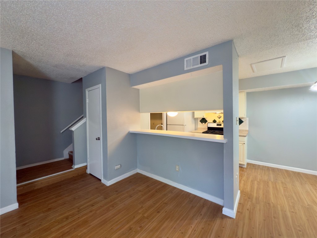 1312 Southport Drive, Unit B Austin, TX 78704 - Photo 6 of 15 a view of empty room with wooden floor