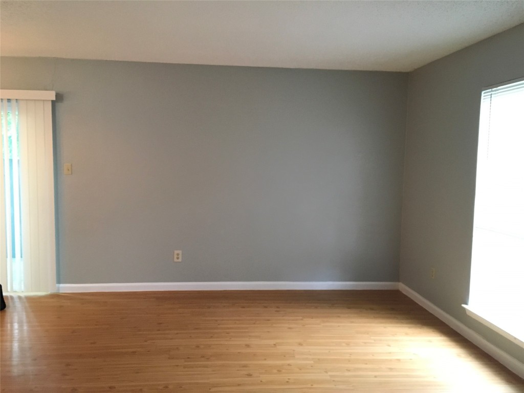 1312 Southport Drive, Unit B Austin, TX 78704 - Photo 9 of 15 a view of a room with wooden floor and a window