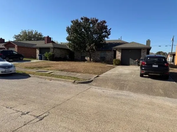 a car parked in front of a house