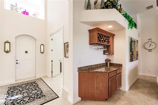 a kitchen with stainless steel appliances granite countertop a refrigerator and a stove