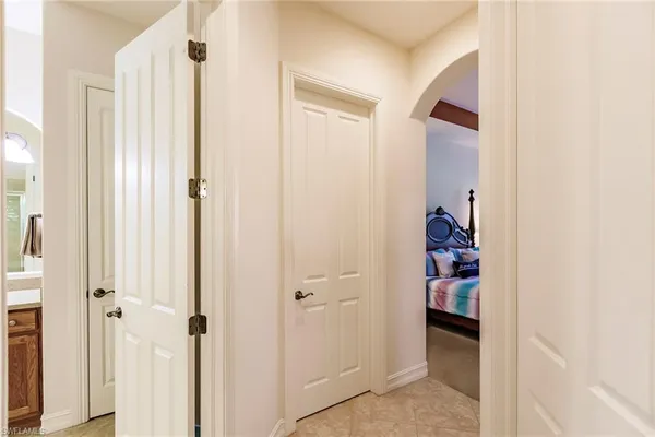 a view of a bedroom with closet and door