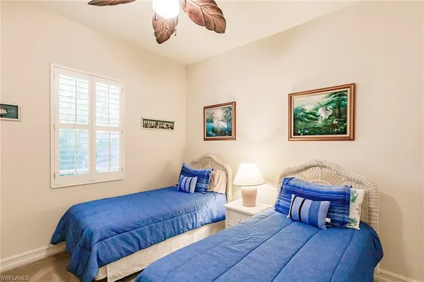 a bedroom with furniture and a window