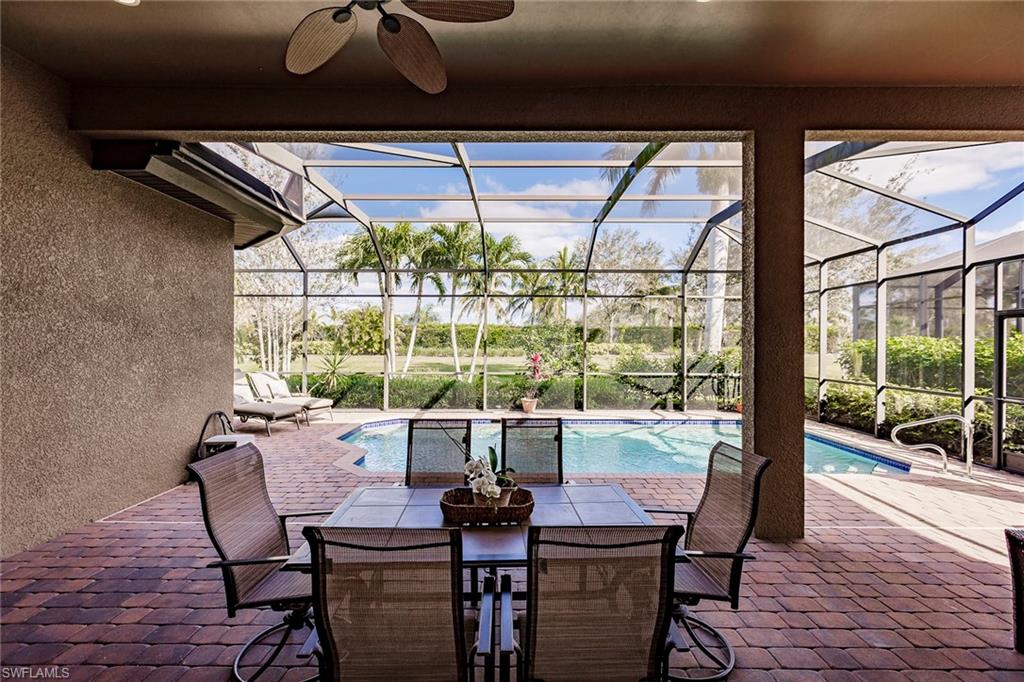 7684 Cottesmore Drive Naples, FL 34113 - Photo 44 of 46 a view of a dining room with furniture window and outside view