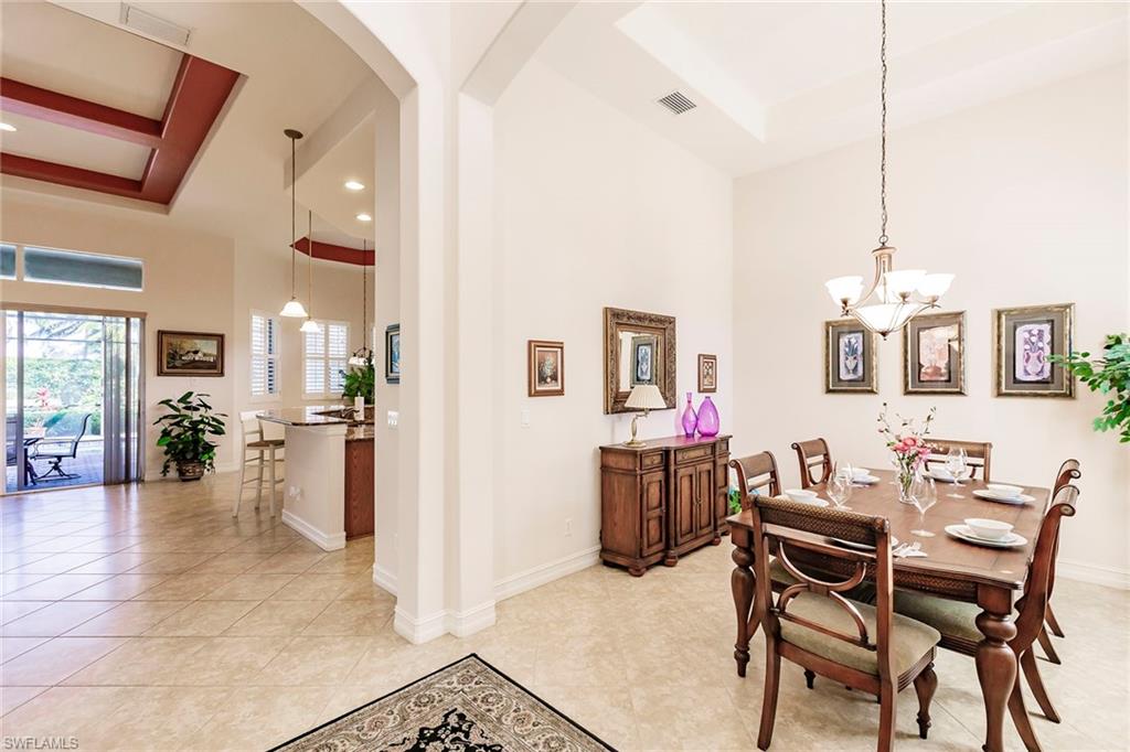7684 Cottesmore Drive Naples, FL 34113 - Photo 6 of 46 a dining room with furniture and wooden floor