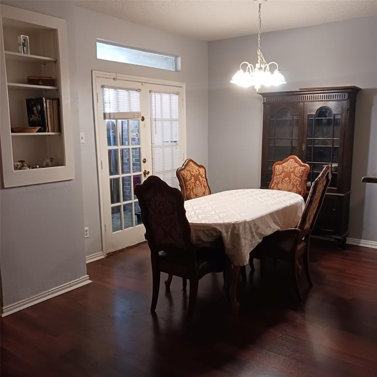 5750 Phoenix Drive, Unit 33 Dallas, TX 75231 - Photo 7 of 14 a view of a dining room with furniture window and wooden floor