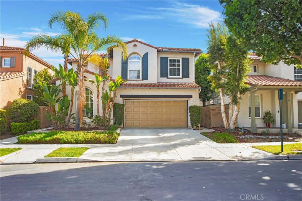 10 Bel Spring Irvine, CA 92602 - Photo 1 of 35 a view of a white house with a small yard and large trees