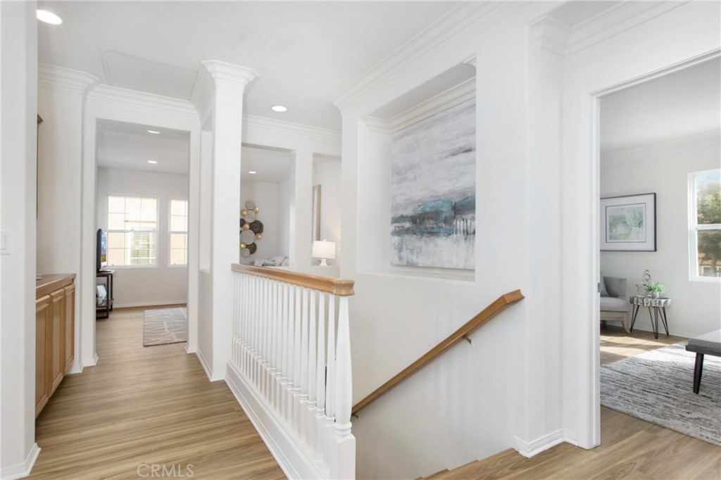 10 Bel Spring Irvine, CA 92602 - Photo 21 of 35 a view of a hallway with wooden floor and staircase
