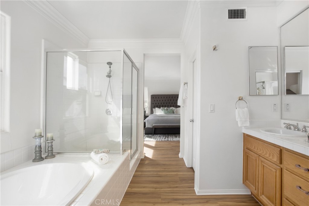 10 Bel Spring Irvine, CA 92602 - Photo 22 of 35 a en suite bathroom with a tub sink and shower