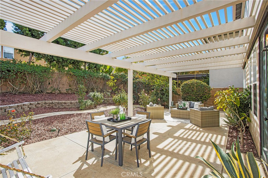 10 Bel Spring Irvine, CA 92602 - Photo 28 of 35 a dining room with a furniture and garden view