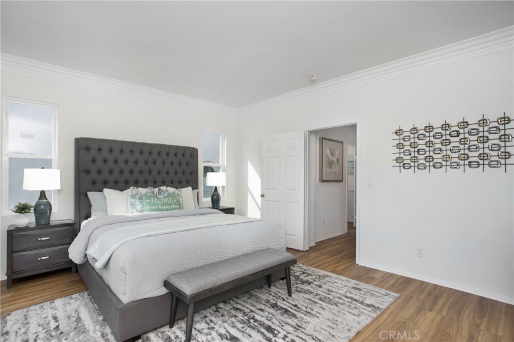 10 Bel Spring Irvine, CA 92602 - Photo 29 of 35 a bedroom with a bed rug and wooden floor