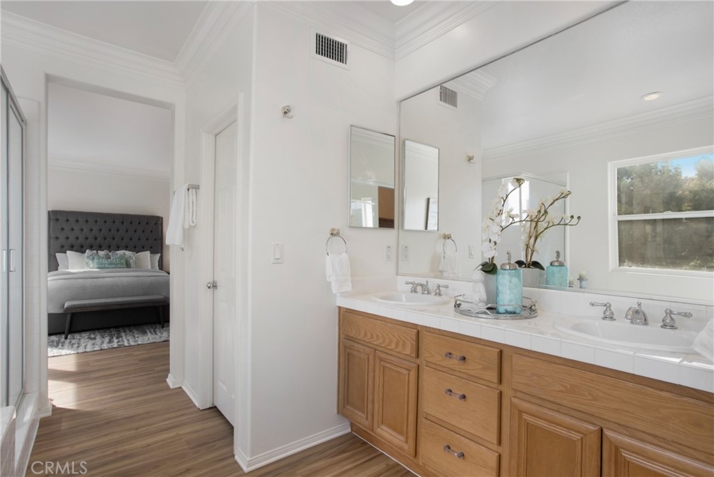 10 Bel Spring Irvine, CA 92602 - Photo 30 of 35 a en suite bathroom with a double sink and mirror