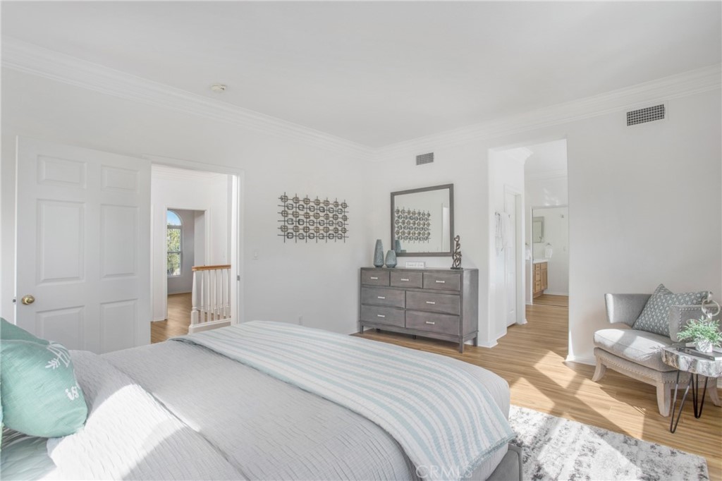 10 Bel Spring Irvine, CA 92602 - Photo 32 of 35 a bedroom with a bed and a dresser